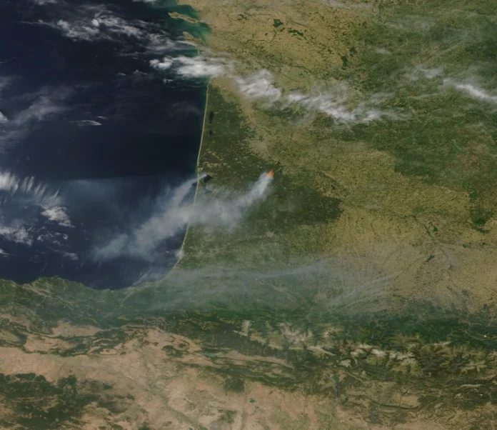 France Wildfire Evacuation Crisis Thick smoke rising from forest wildfires near the French Atlantic coast during a severe heatwave
